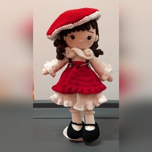 Adorable Crochet Doll with Red Dress and White Accents